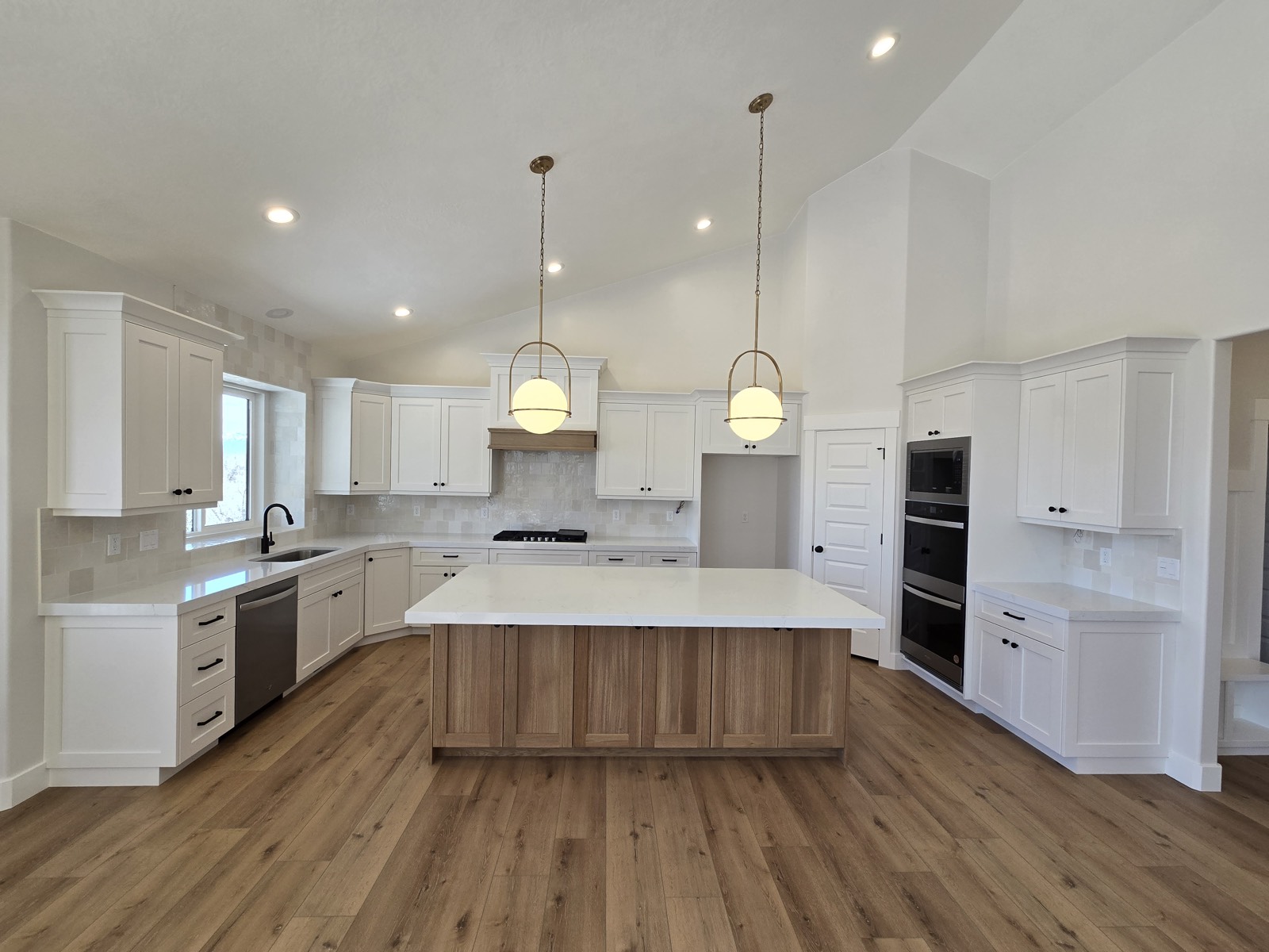 Remodeled kitchen with new flooring, cabinets, and counter space