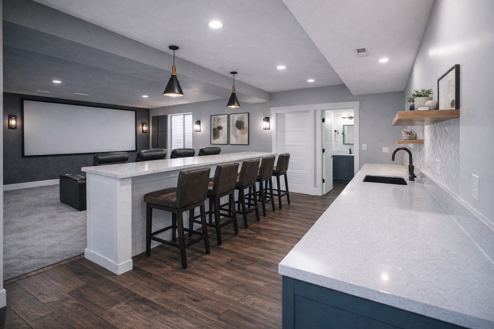 Basement apartment kitchenette open to a home theater room